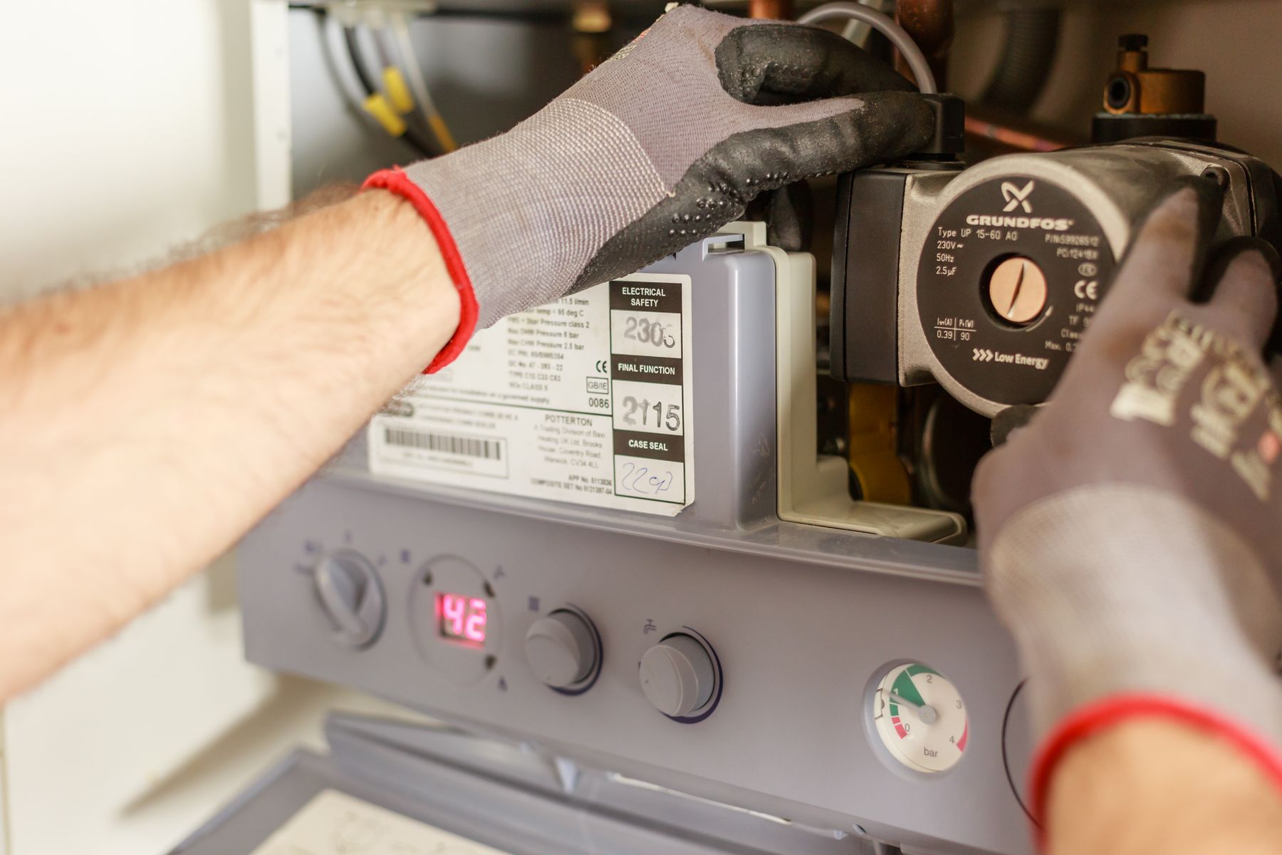 Technician adjusting a heating system