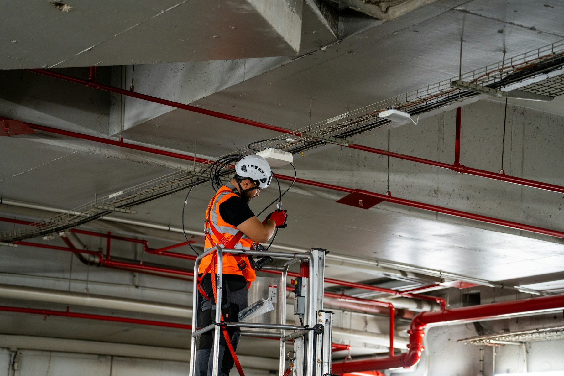 Technician installing ceiling components